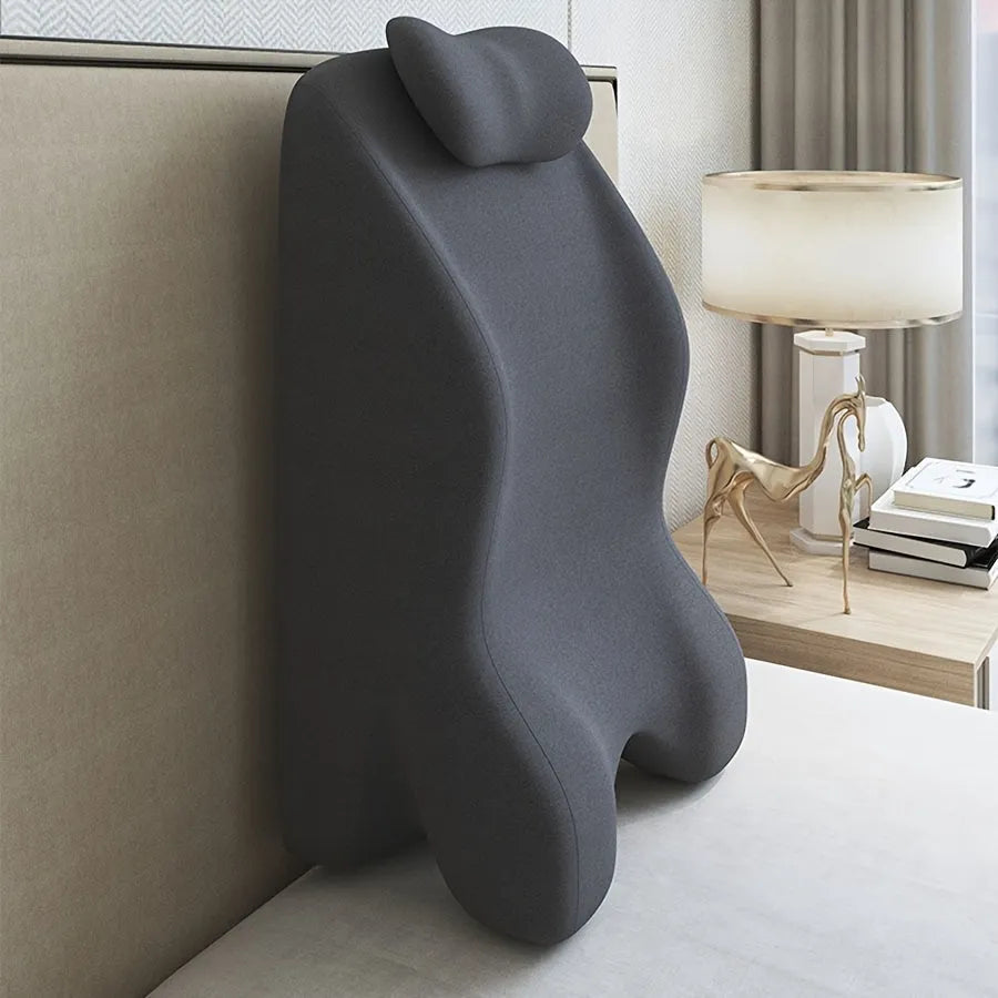 Stomach sleeper pillow designed for reading and phone use while lying down in blue colour option