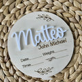 Square wooden baby name plaque with birth information, 15cm by 15cm.