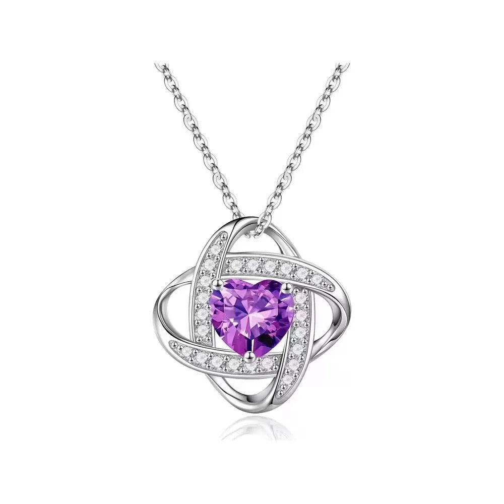 Women's electroplated copper heart-shaped necklace on a model, showing the red diamond colour variant.