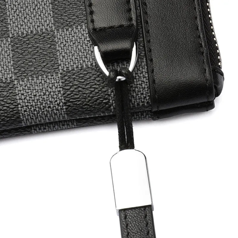 Men's black leather clutch wallet made from cowhide, showing plaid texture and open view of polyester lining.