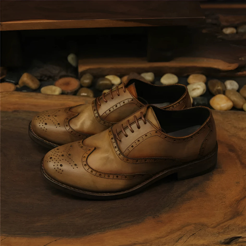 Men's light brown vintage leather shoes with distressed finish and round toe lace-up design.