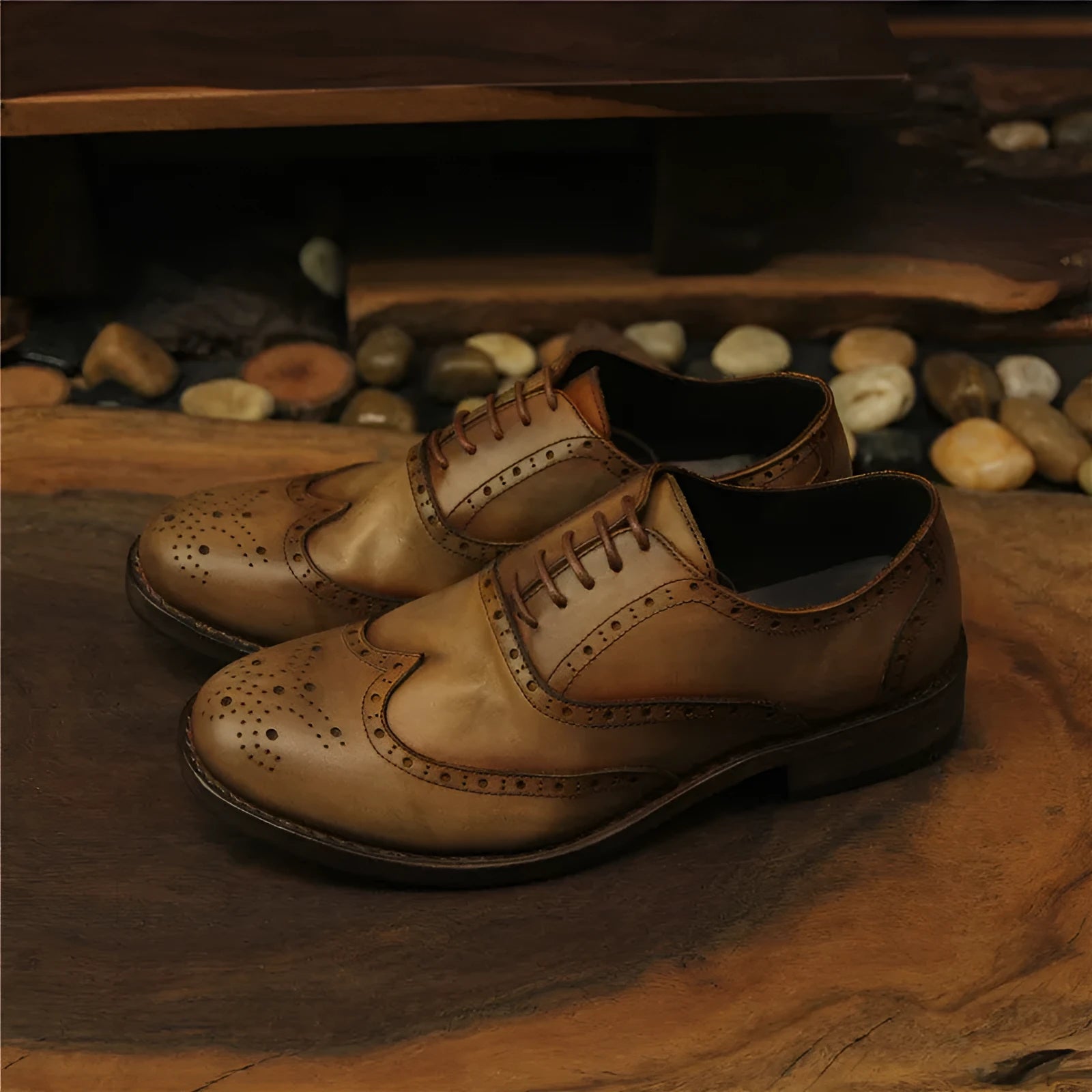 Men's light brown vintage distressed leather shoes with engraved detailing and round toe.