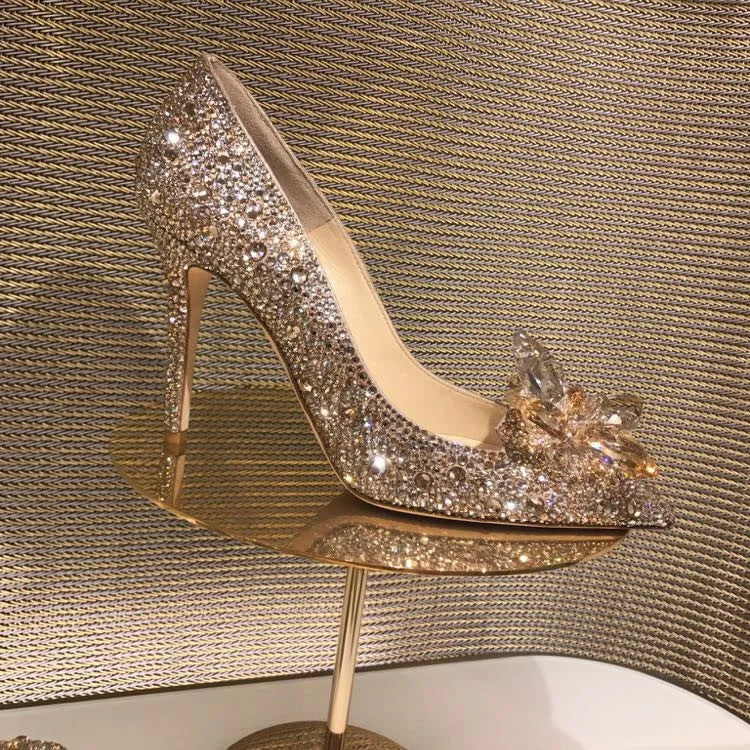 Gold women's pointed toe stiletto heels with rhinestone and sequin decoration on a 7cm heel.