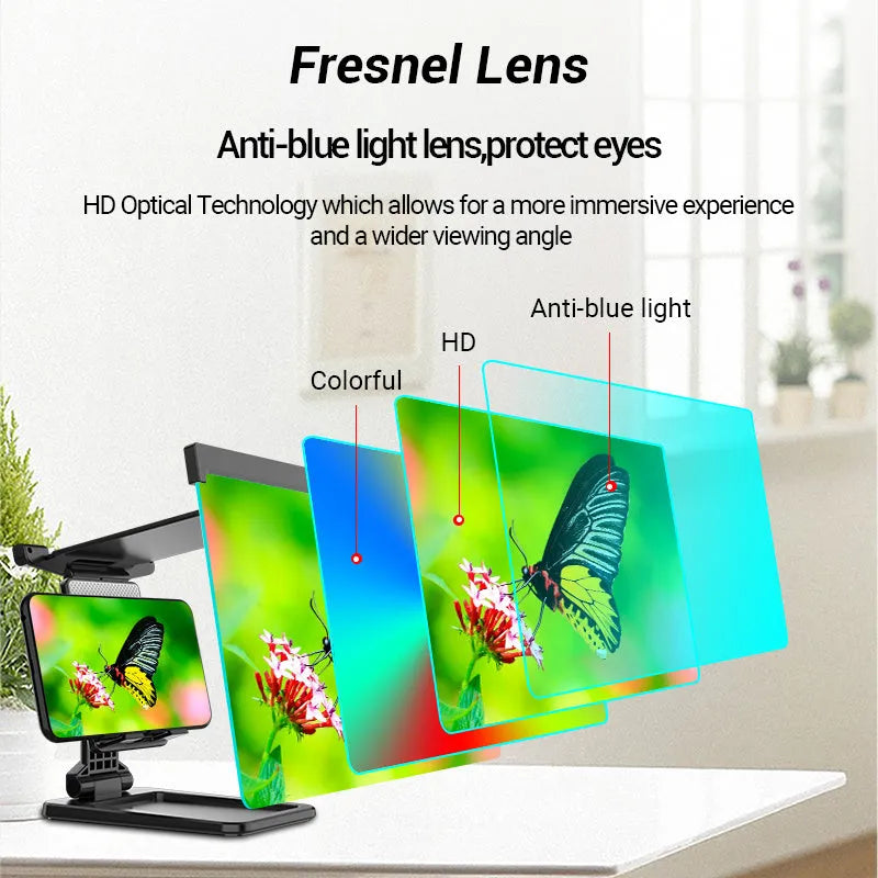 Black folding mobile phone screen magnifier and detachable phone holder on a desk.