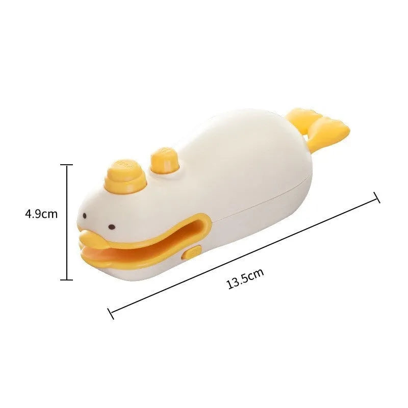 Small yellow rechargeable sealing machine with animal jacquard pattern and charging cable.
