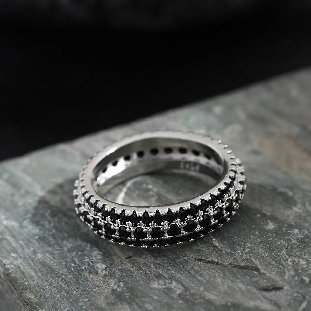 Geometric personalised ring with triangular design and zircon stone, shown in a gold colour finish.