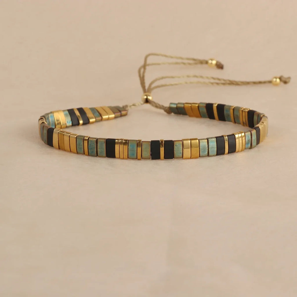 Geometric pull beads bracelet in glass or coloured glaze with round elements
