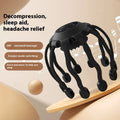 Black and white head massagers with multiple vibrating claws on a stand.