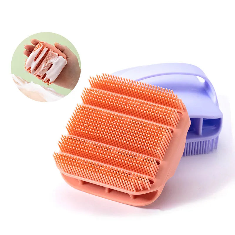 Blue silicone scalp massager brush with hand-strap handle for washing and massaging hair.