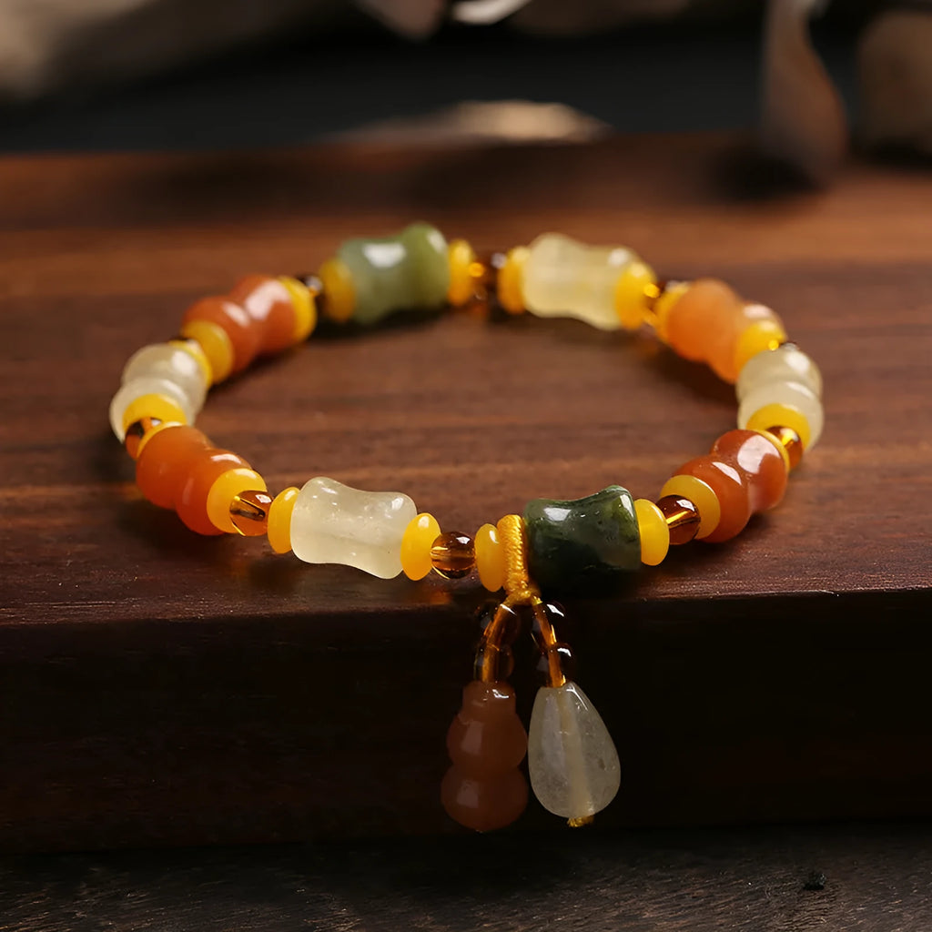Natural Jinsi Jade small bone beads bracelet with geometric shape and auspicious patterns.