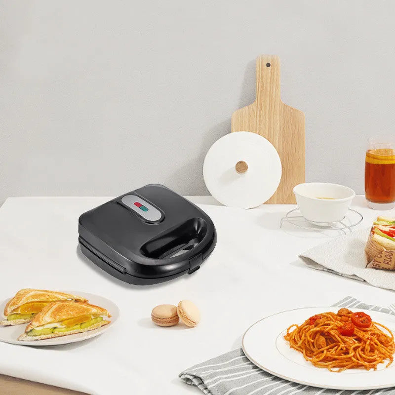 Black double-sided heating electric sandwich pan with brushed stainless steel lid and non-stick plates