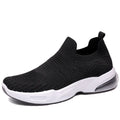 Lightweight black slip-on sock shoes with a low-top design and textured PVC sole.
