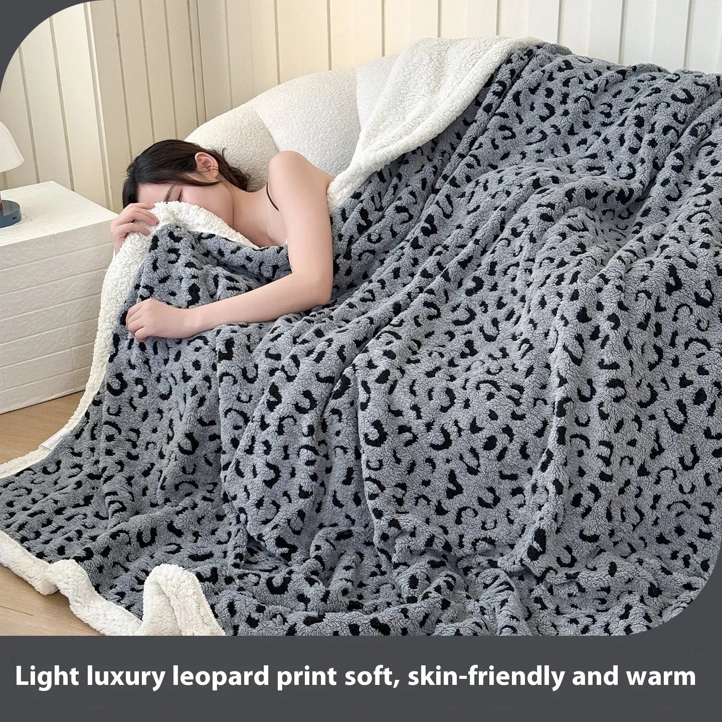 Double-layer cationic leopard jacquard taffeta blanket showing reversible design with zebra pattern