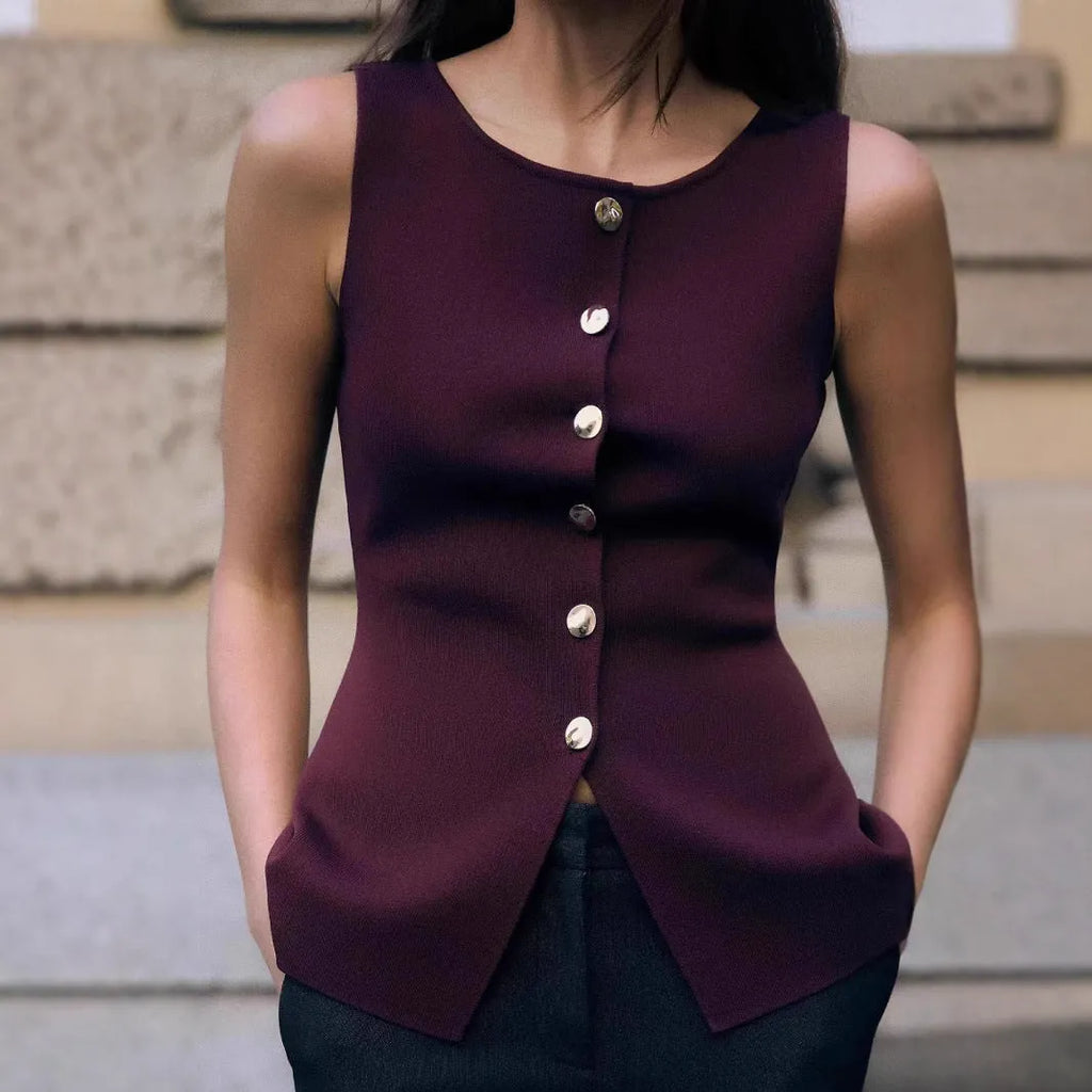Women's dark red viscose knit sleeveless vest with gold buttons, shown on a model.