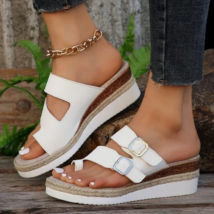 White patent leather wedge sandals with finger fit design and peep toe