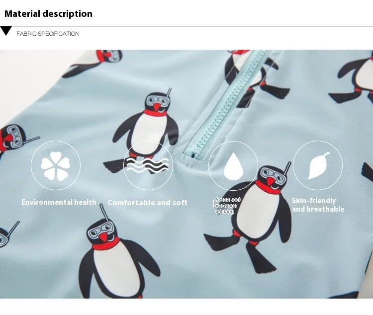 Boy in penguin print long sleeve one-piece swimsuit and matching swimming cap