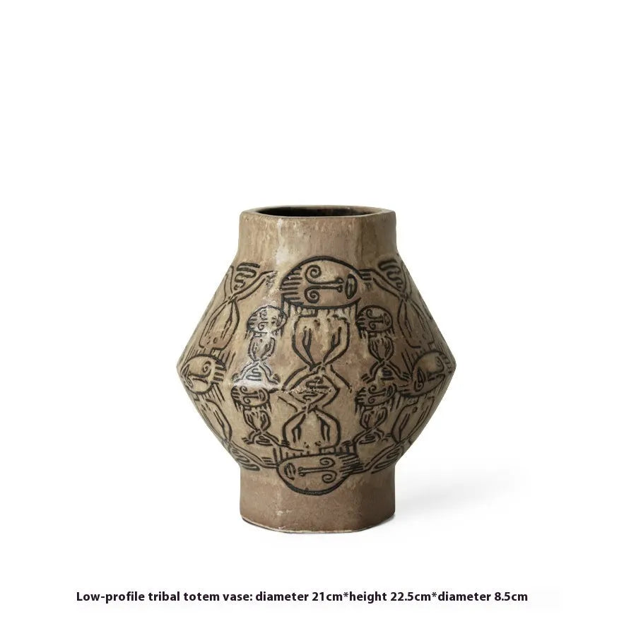 Hand-painted cylindrical ceramic vase with vintage carved tribal totem patterns in high or low style.