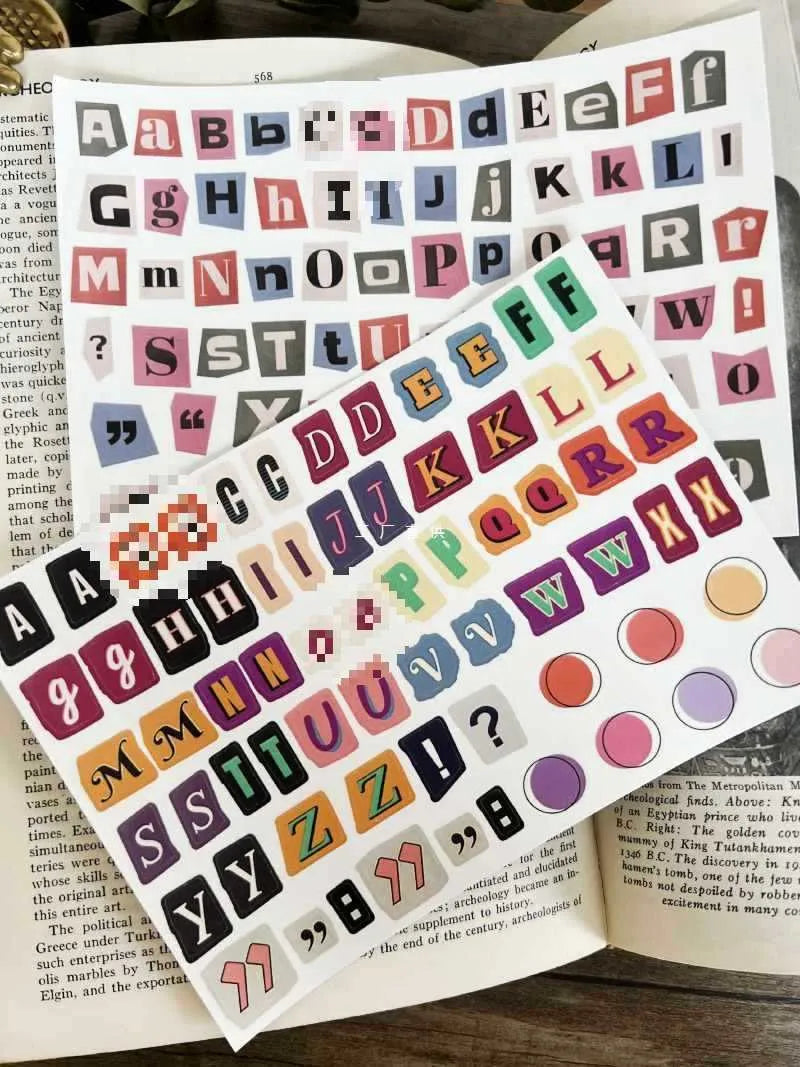 A4 sheet of colourful English alphabet, number, and word stickers in a cute style for decoration and organisation.