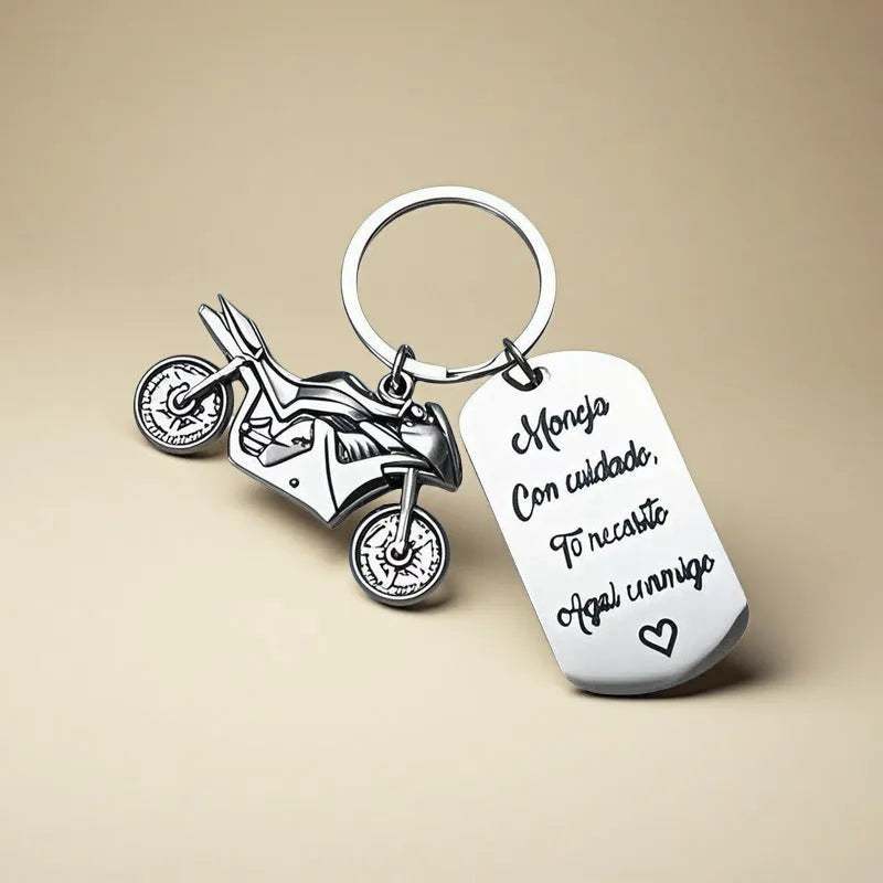 Stainless steel motorcycle-themed keychain with charm and a red flannel storage pouch.