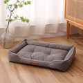 Grey waterproof Oxford cloth dog sofa bed with a high-rebound cushion, shown in a medium size.
