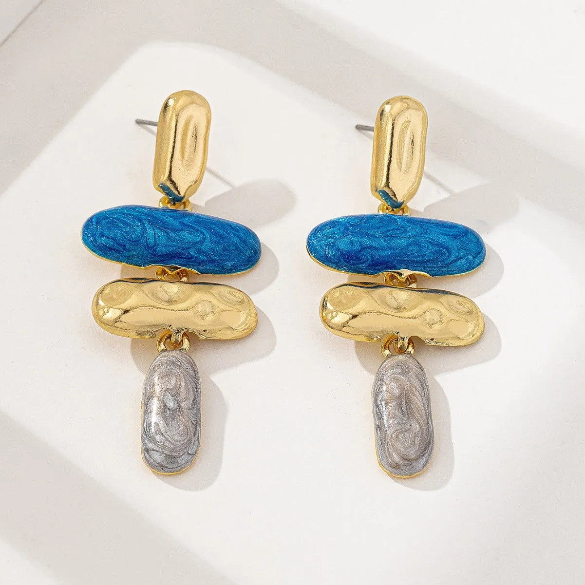 A pair of multicolour geometric stud earrings for women with a zinc alloy base and electroplated finish.