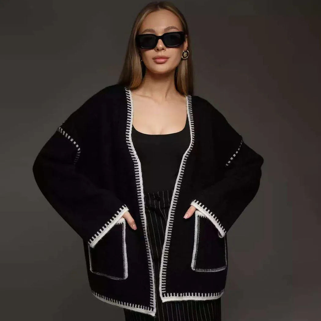 Lace-up front knitted cardigan in black, camel, or white, showing loose fit and thick fabric.