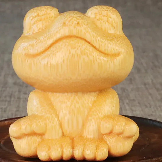 Solid bamboo smiling frog carving ornament measuring 5cm high with cartoon cute style