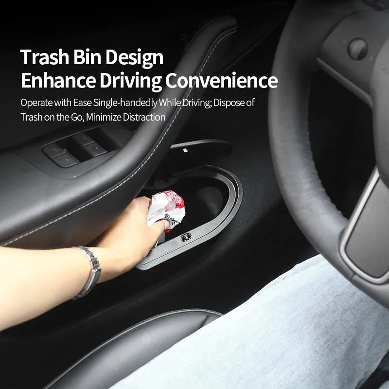Two black ABS plastic storage and trash can bins designed for the front door panels of a Tesla Model Y.