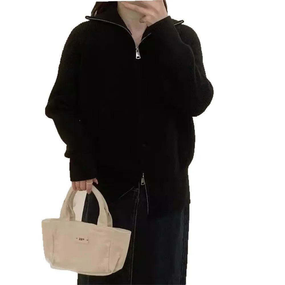 Grey Hong Kong style double zipper knitted cardigan with floral pattern on a hanger.