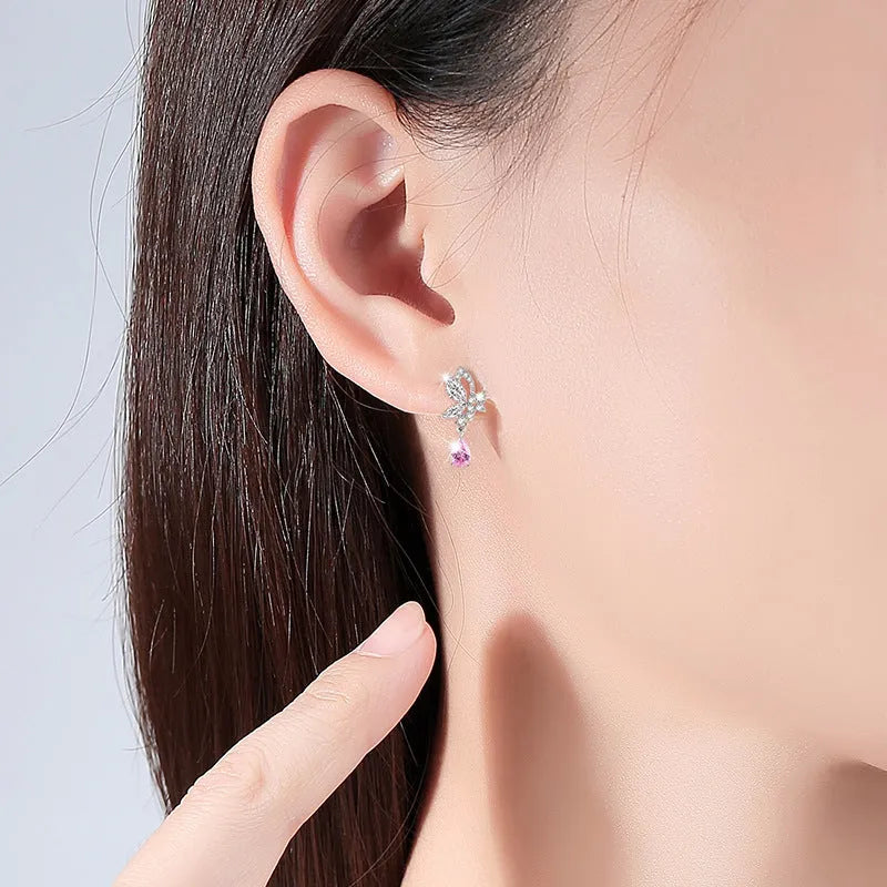Women's silver butterfly stud earrings with crystal details on 925 sterling silver posts
