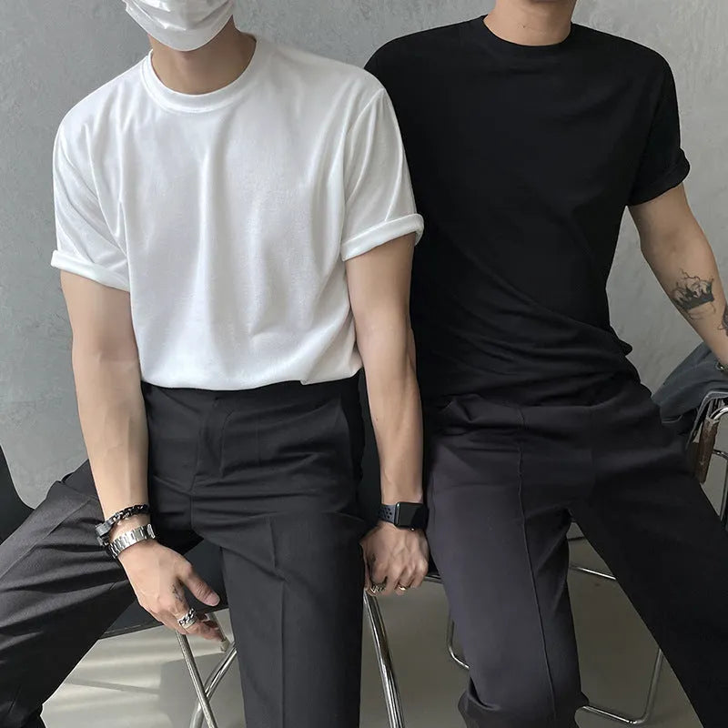 Men's slim fit cotton t-shirt in black on a hanger, showing round neck and half sleeve design.