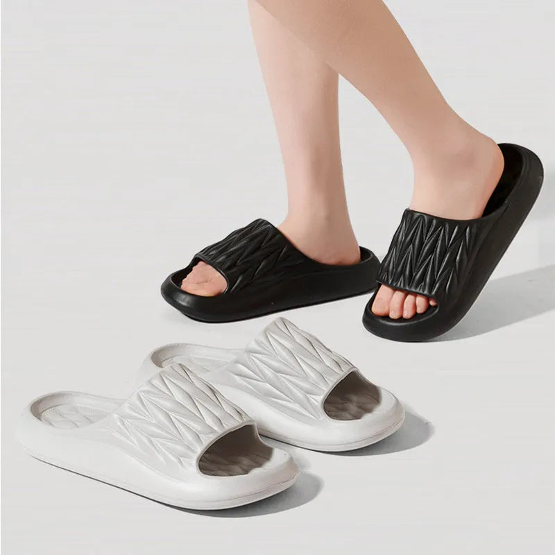 Leaf texture design EVA foam indoor slippers in assorted colours on a white background.