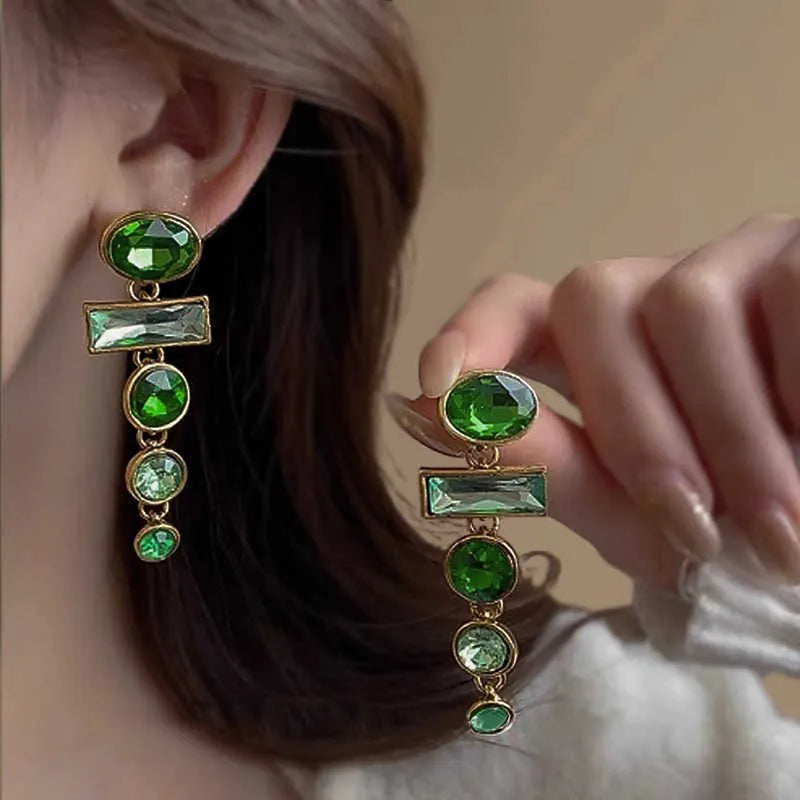 Green gradient tassel dangle earrings with geometric metal frame and sparkling zircon stones.