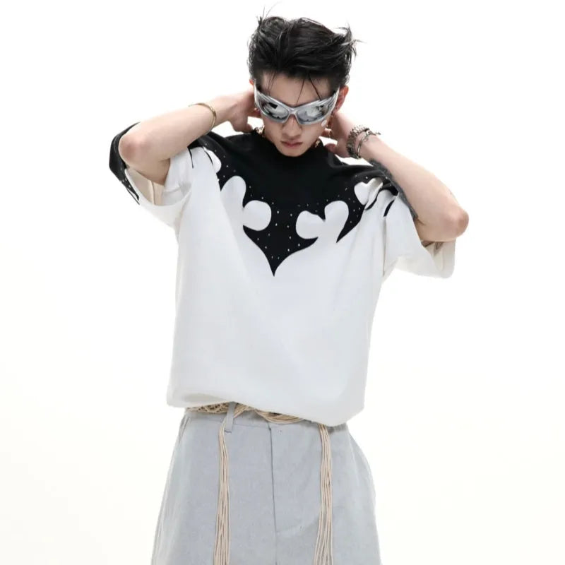 Grey men's T-shirt with raised black floral embroidery and rhinestone details on a dropped shoulder, loose-fit design.