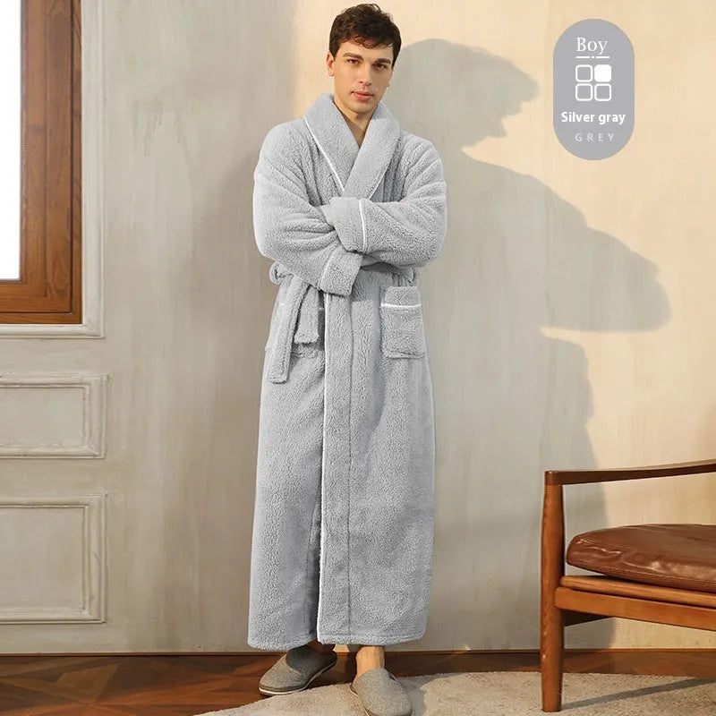 A man and woman wearing matching thick, navy blue flannel bathrobes in a European style cut.