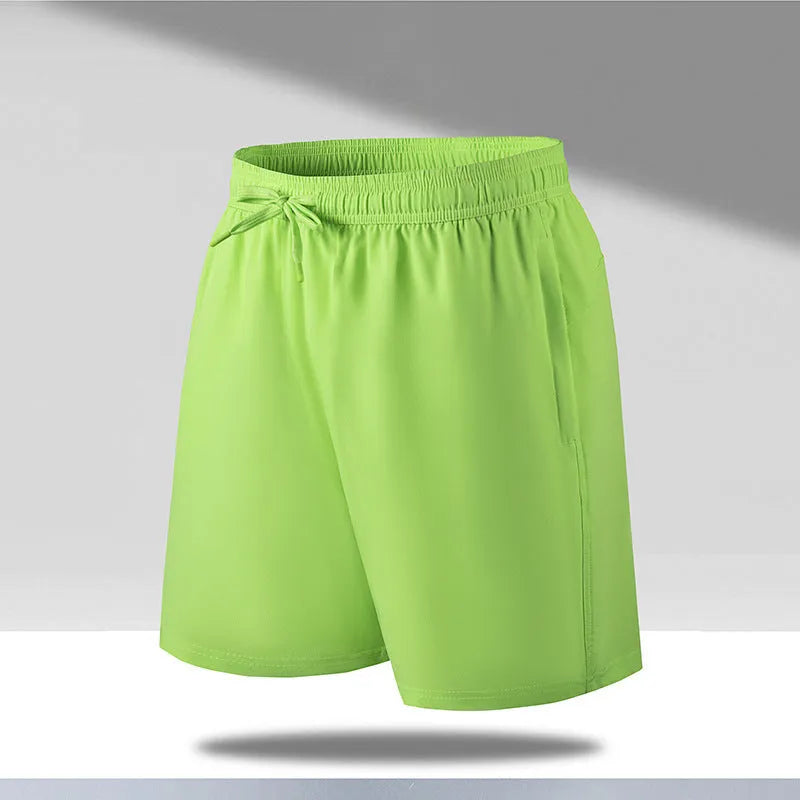 Man wearing loose fit quick-dry polyester beach shorts in a summer colour