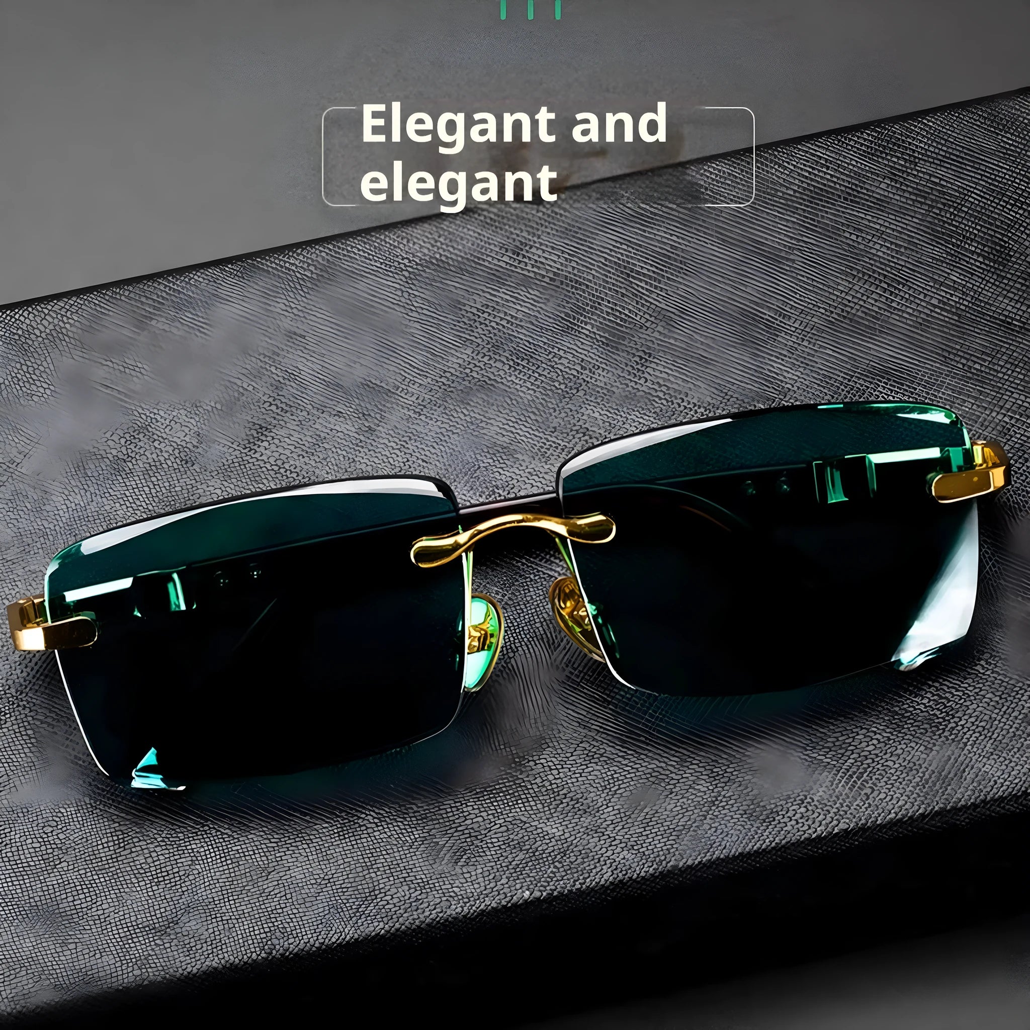 Frameless dark green crystal sunglasses with metal arms on a table next to their hard case.