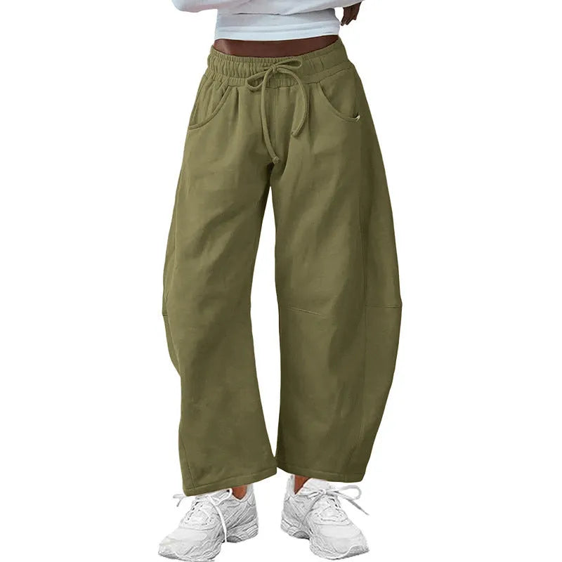 Women's loose cropped sweatpants with drawstring waist and side pockets in apricot colour