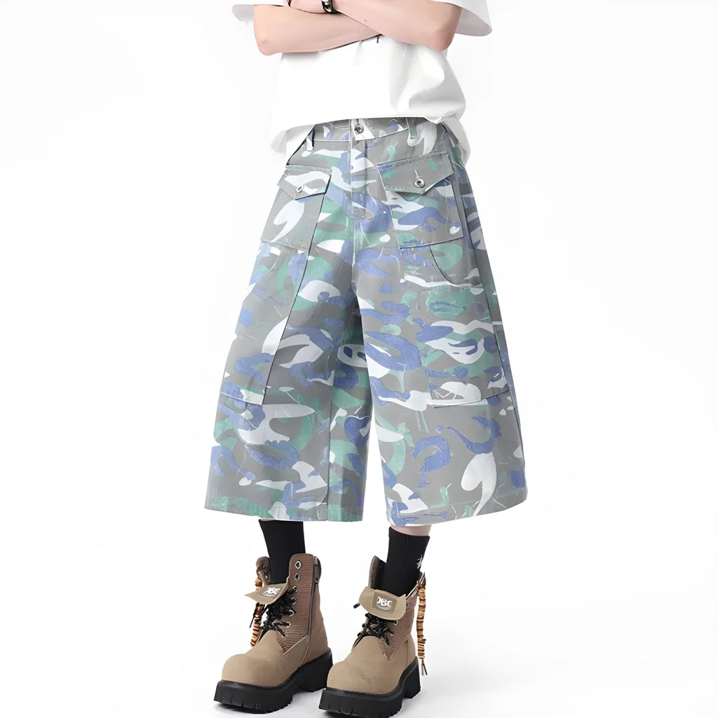 Women's cropped camouflage denim cargo trousers with a pocket on the leg.