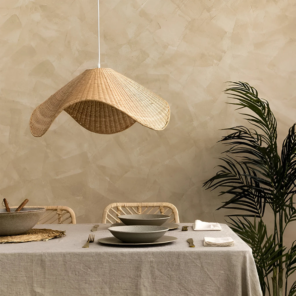 Handmade bamboo rattan chandelier with woven straw and willow lampshade in warm light