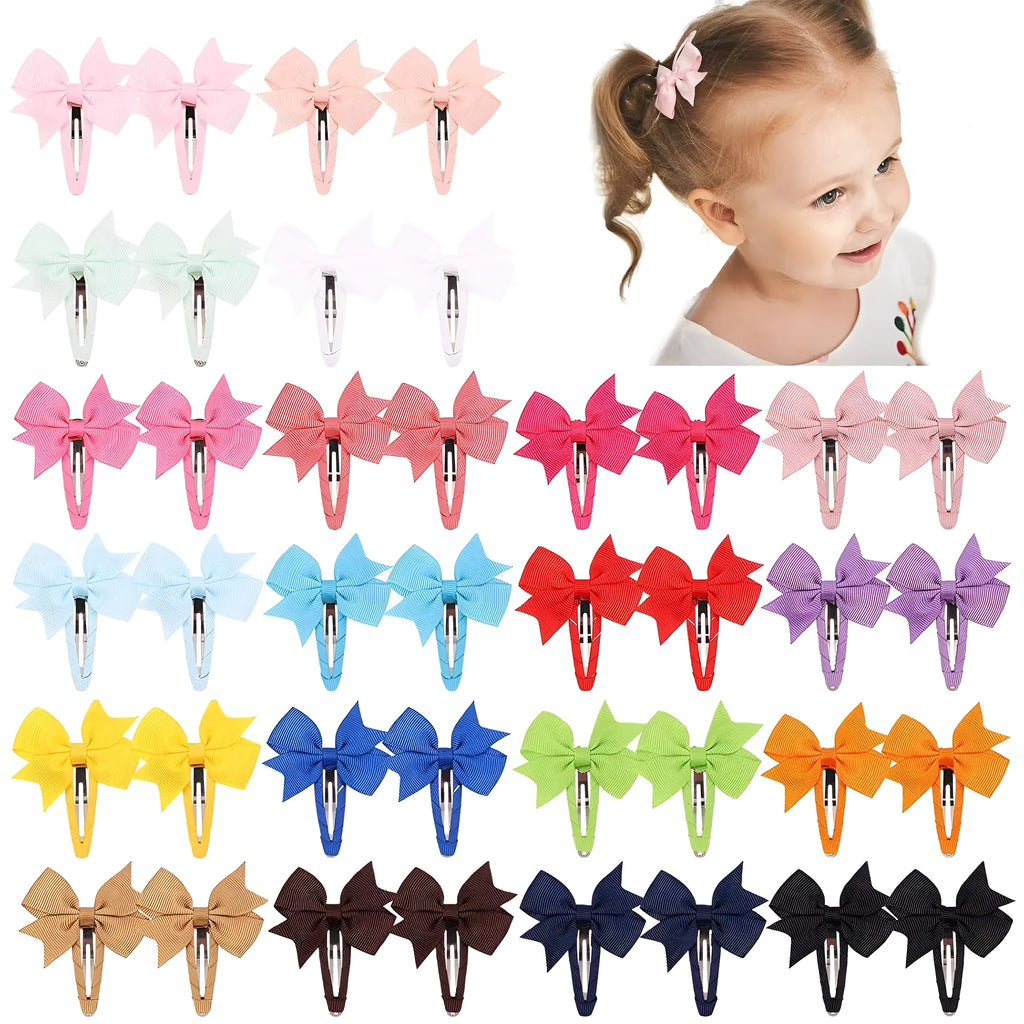 40 assorted colour grosgrain ribbon baby hair bow clips with fully wrapped snap barrettes on a white background.