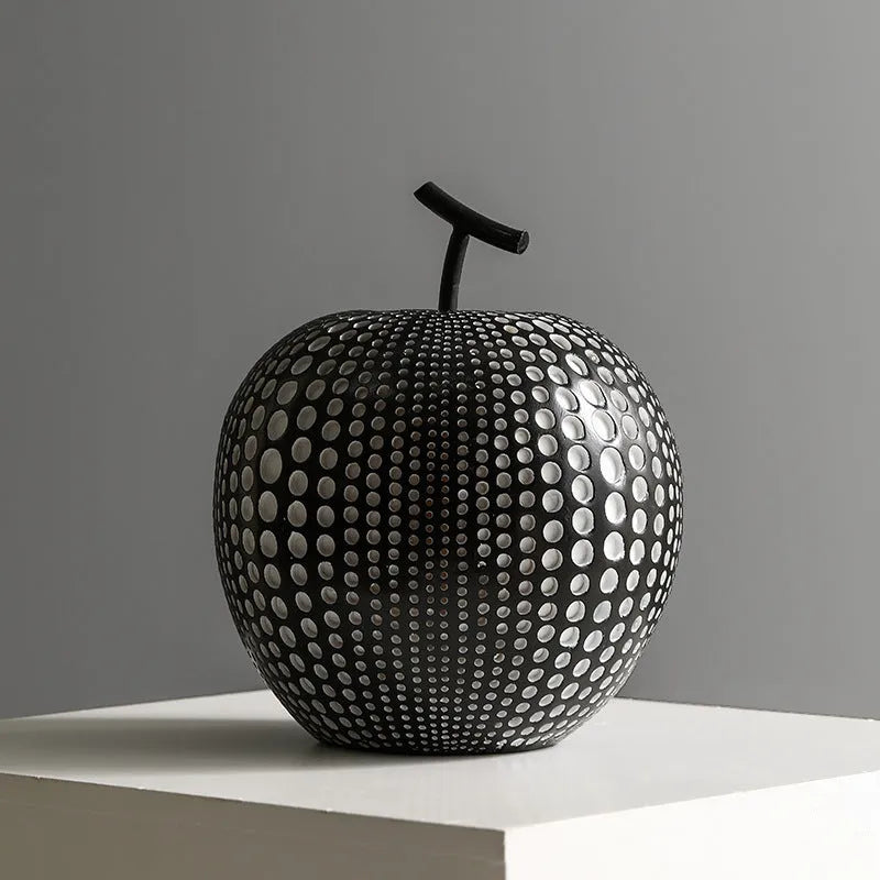 Resin apple and pear ornaments, black high model 17cm by 14cm and white low model 16cm by 12cm.