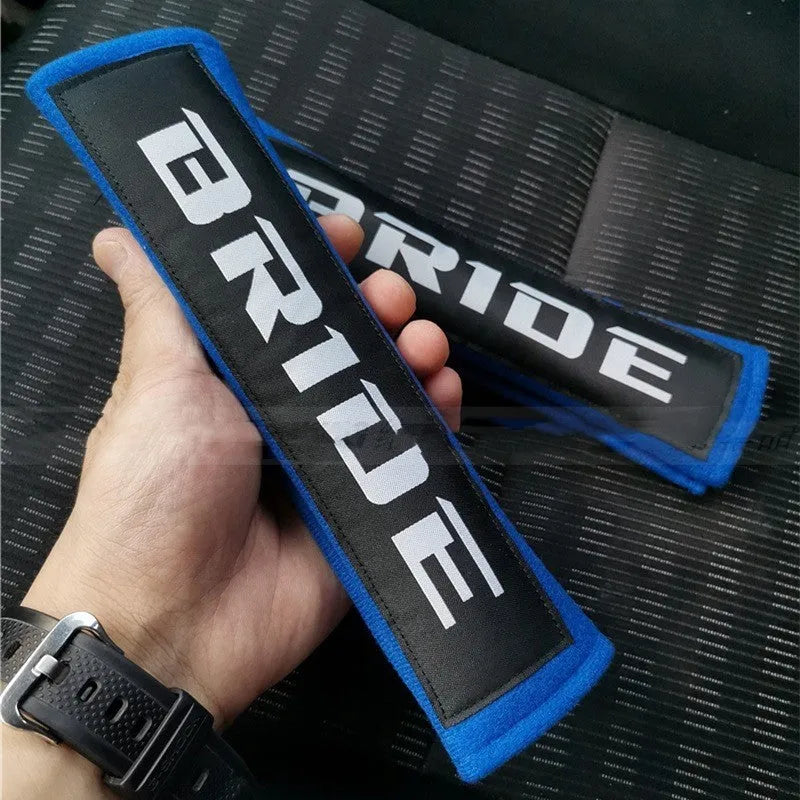 Car seat belt shoulder pads in black, blue and red options with cotton sponge cloth construction