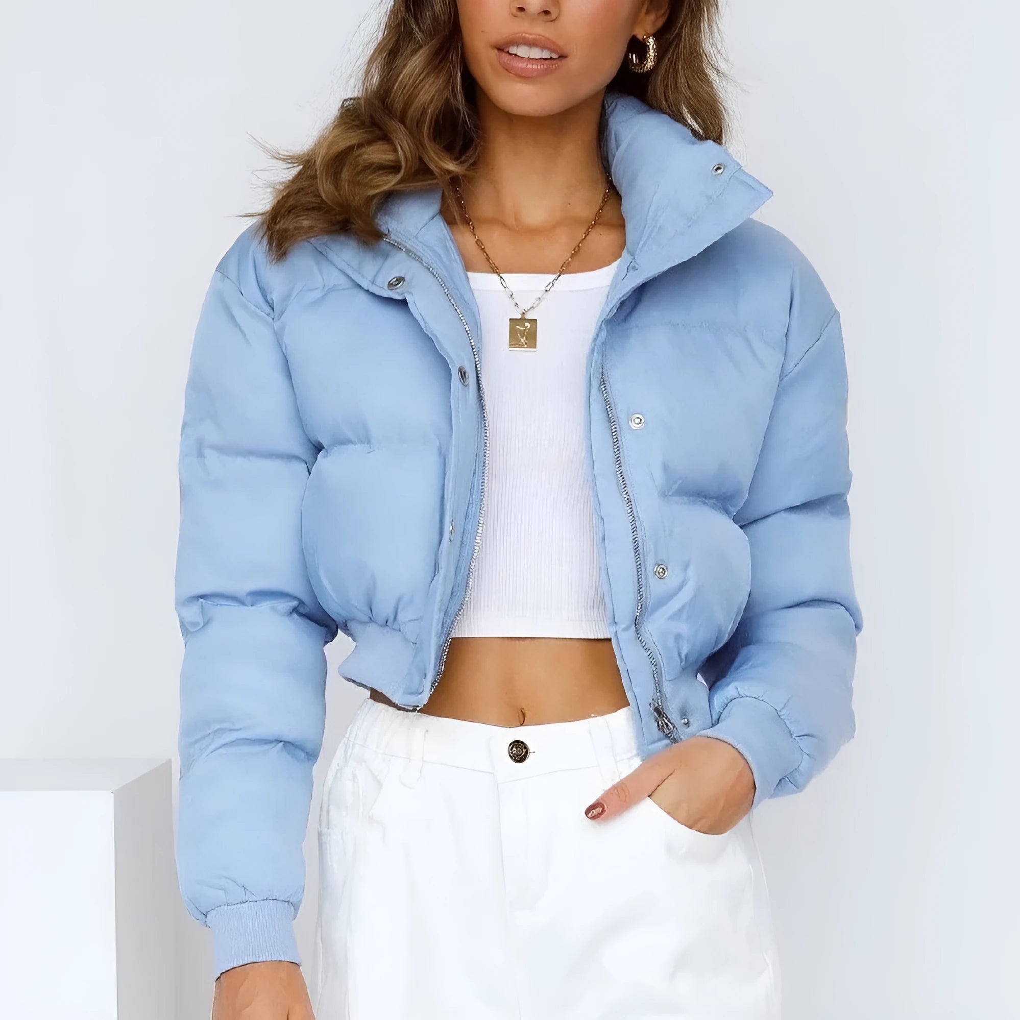 Loose blue polyester jacket for women with long sleeves on hanger