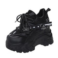 White women's low-top platform sports shoes with a cross-strap and breathable mesh upper on a rubber sole.
