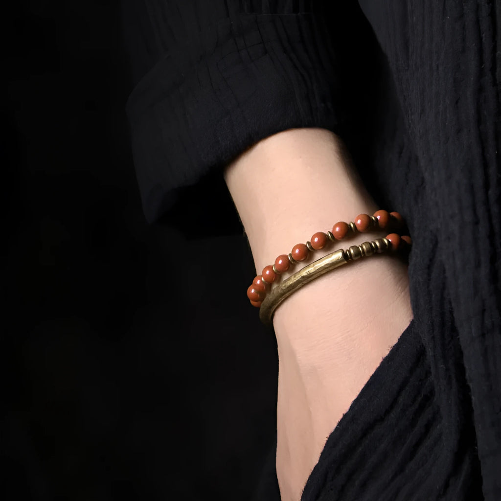 Layered retro ethnic bracelet with stone beads in water grass agate, obsidian, and red jasper colours