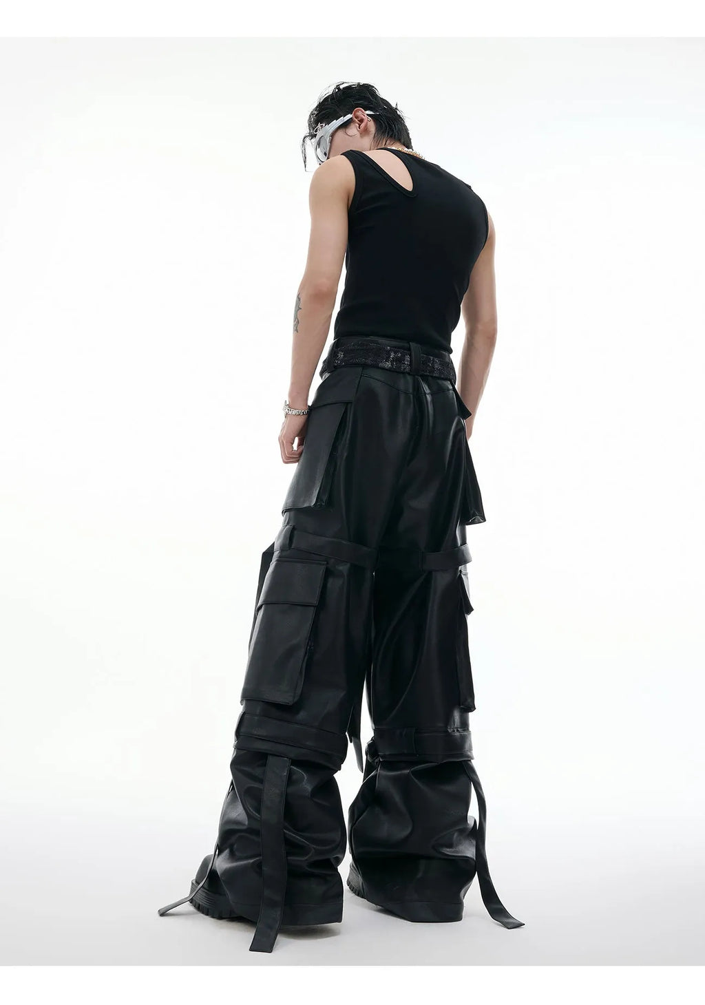 Black loose-fit multi-pocket trousers with quilted stitching detail.