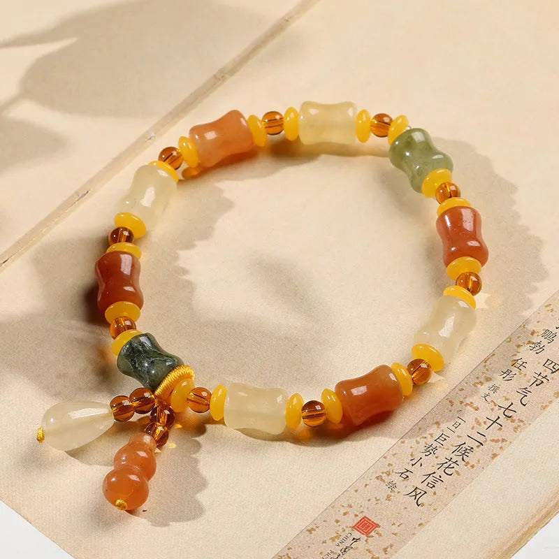 Natural Jinsi Jade small bone beads bracelet with geometric shape and auspicious patterns.