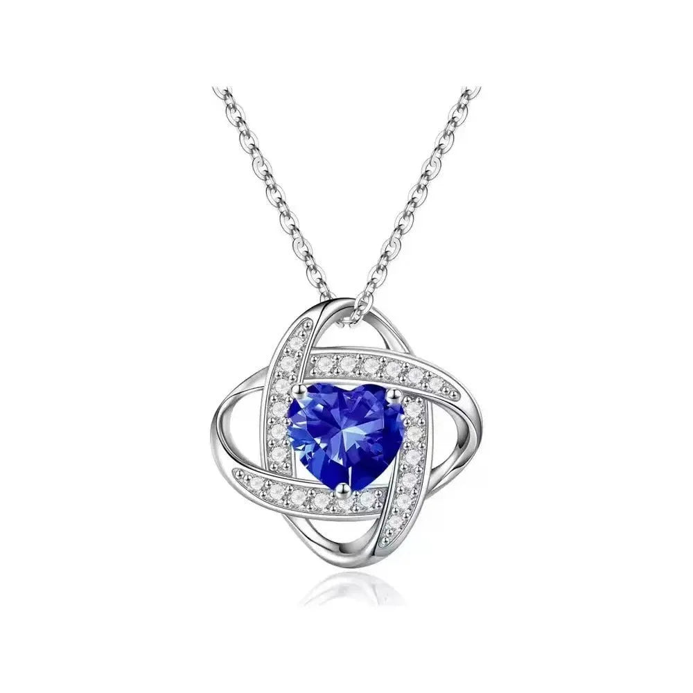 Women's electroplated copper heart-shaped necklace on a model, showing the red diamond colour variant.