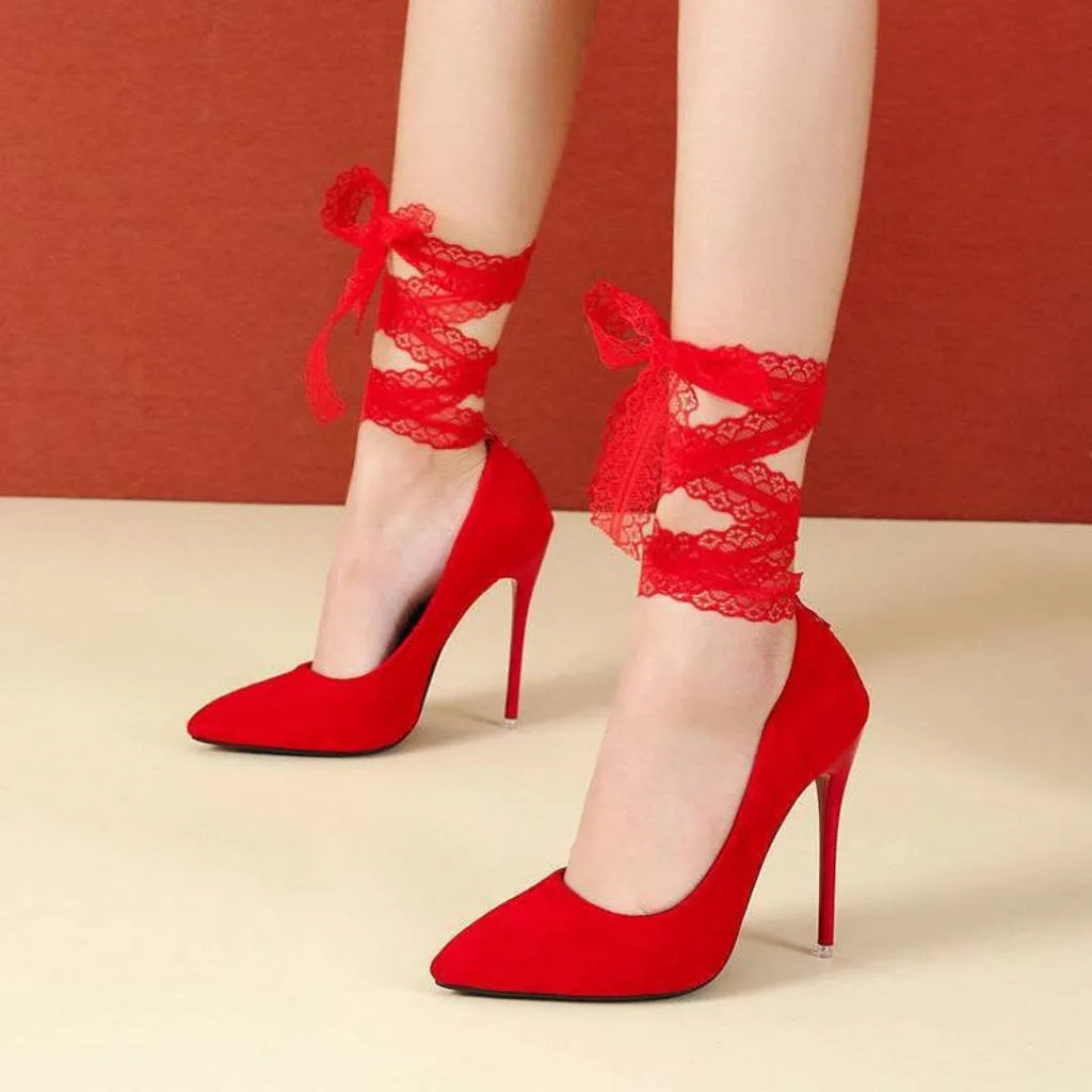 Women's black platform court shoe with pointed toe and lace ankle strap on a 12cm heel.